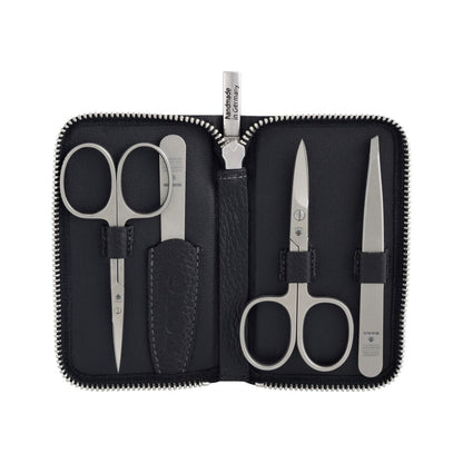 Dovo care case No. 5 in black cowhide with four satin-finished stainless steel instruments